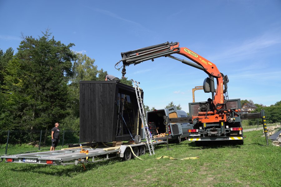 Sauna being delivered with a crane truck